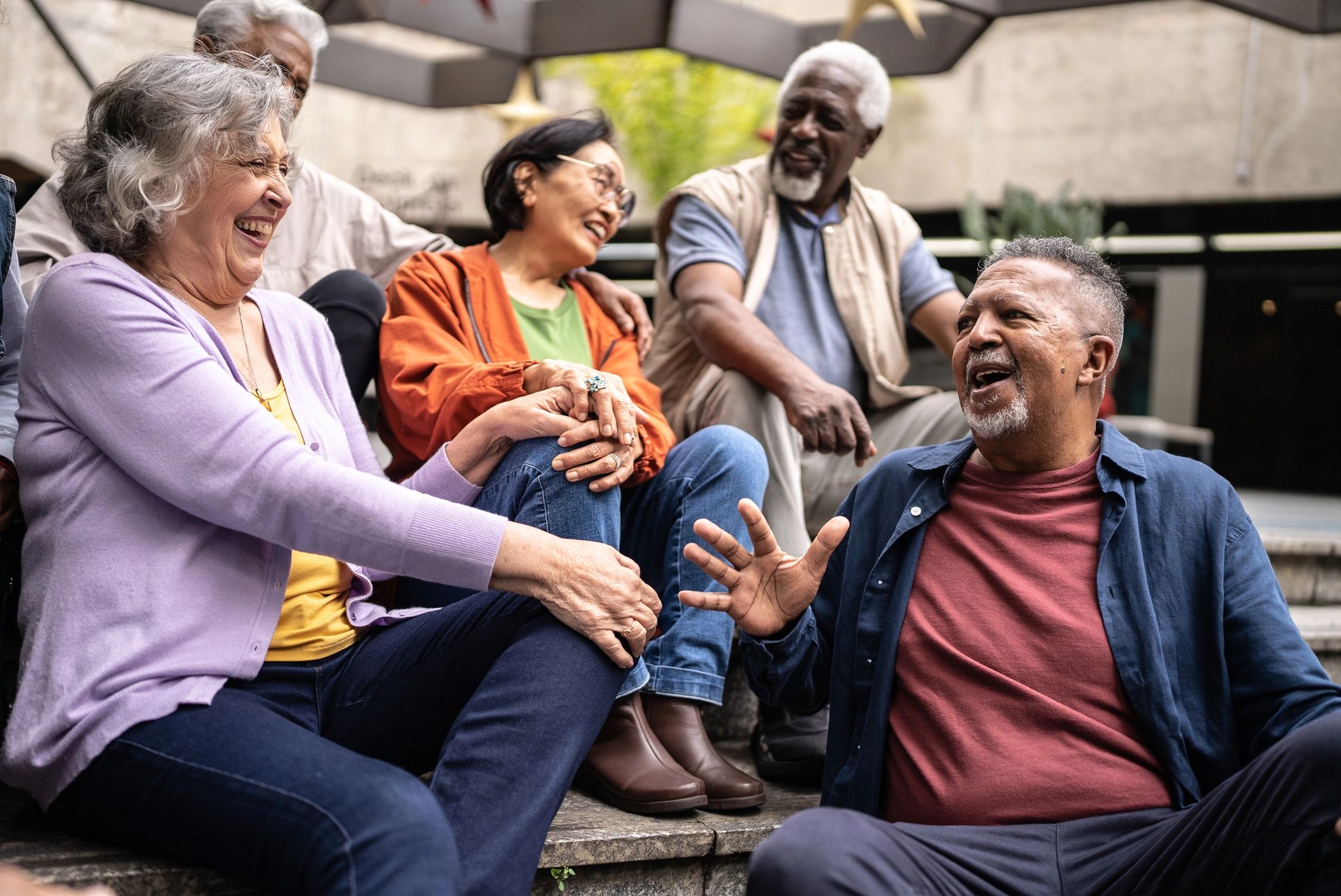 A group of older adults from different backgrounds visiting outdoors